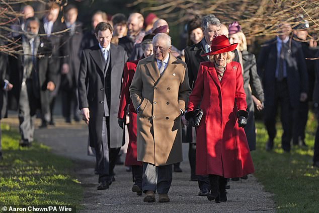 Camilla wore a festively red overcoat and stylish hat as she walked alongside a smiling King Charles on a sunny but bitingly fresh Thursday morning as the led members of the family to St Mary Magdalene Church.