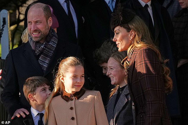 The Prince of Wales rests a hand on his youngest son Louis's shoulder as the family leaves the church on Christmas morning