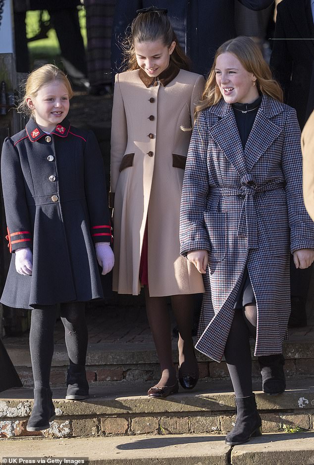 Lena flashing an adorable gap-toothed smile as the seven-year-old accompanied Charlotte and Mia towards the crowds of well-wishers outside the church