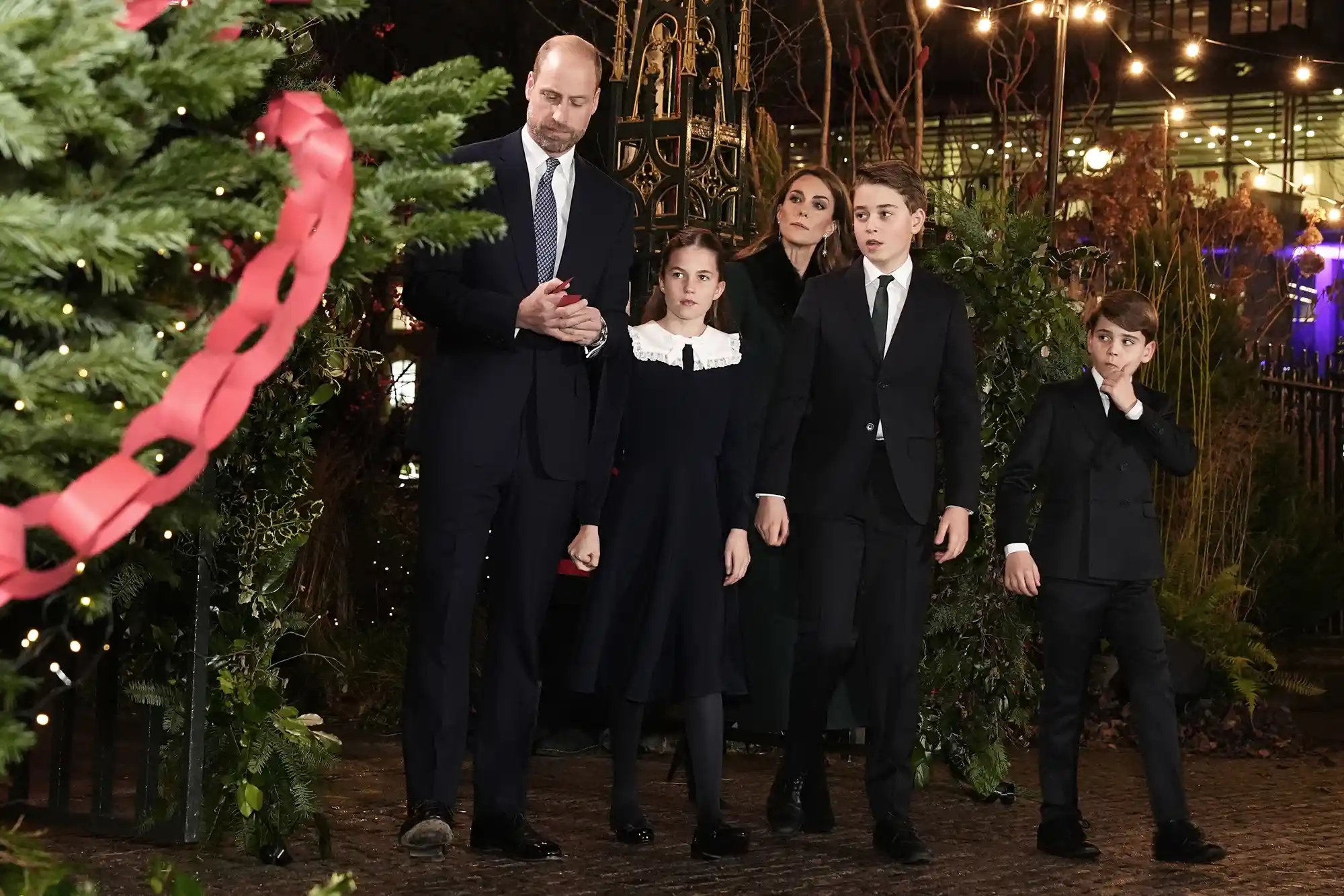 Prince William, Prince of Wales, Catherine, Princess of Wales with their children Prince George, Princess Charlotte and Prince Louis look at messages on the Kindness Tree ahead of the Together At Christmas carol service at Westminster Abbey on December 5, 2025 in London, England. Led by The Princess and supported by The Royal Foundation, the annual event offered a chance to pause and reflect on the values of love, compassion, and the connections we share. The service also highlighted remarkable individuals from across the UK who have demonstrated extraordinary kindness, empathy, and support within their communities.