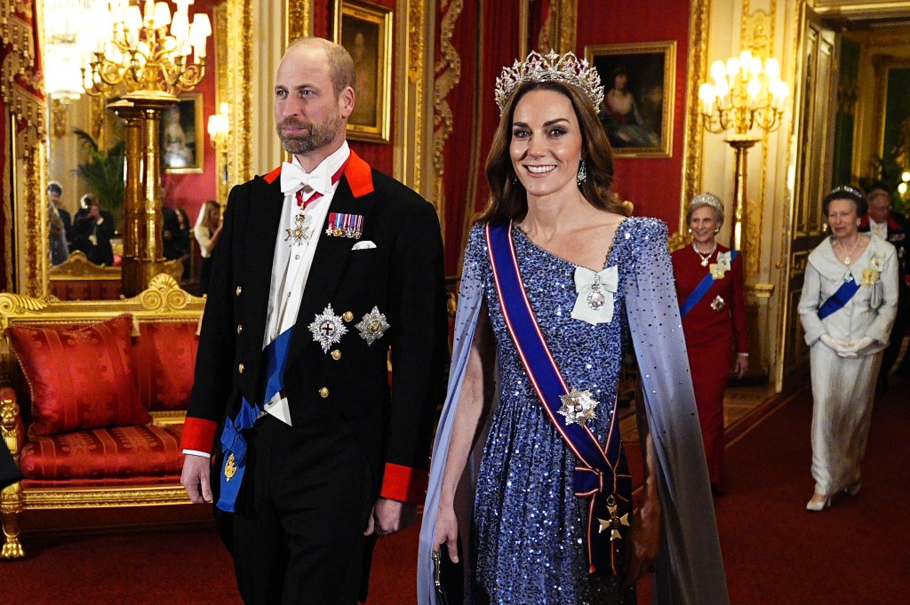 Prince William and Princess Kate, in a blue sparkling gown at Windsor Castle in Windsor, on Dec. 3.