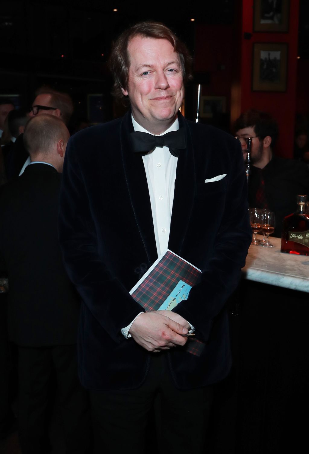 Image may contain Tom Parker Bowles Pratim D. Gupta Clothing Formal Wear Suit Tuxedo Face Head and Person
