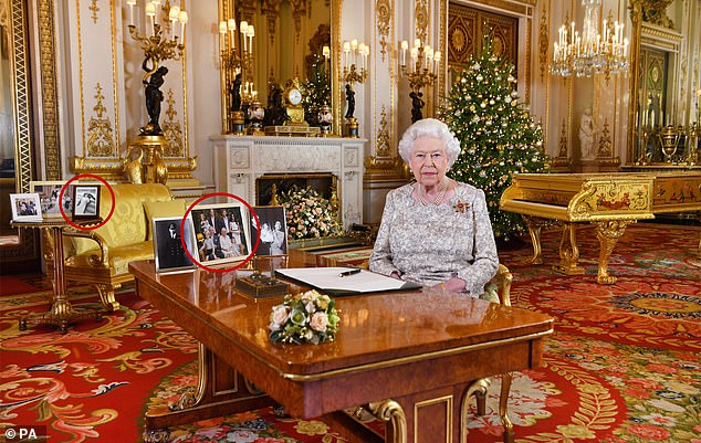 2018: Queen Elizabeth II after she recorded her annual Christmas Day message, in the White Drawing Room of Buckingham Palace in London. Prince Harry and Meghan can be seen in two framed photographs (circled)