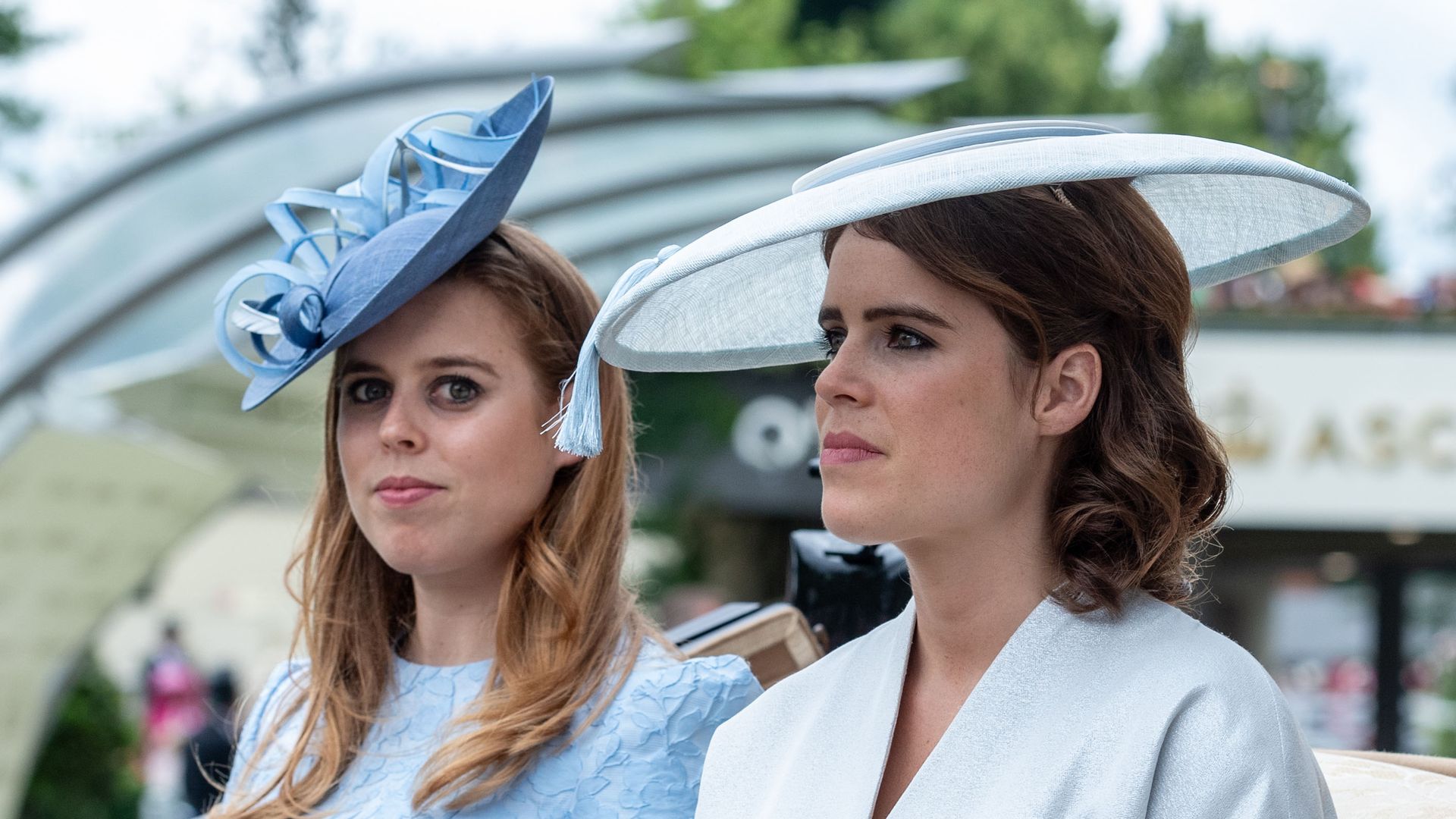 Princess Beatrice and Princess Eugenie sitting together in a carriage