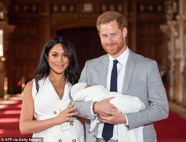 Ms Brown explained in her book Palace Papers that each detail of the monarch's 3pm Christmas broadcast was meticulously planned - and the curation of family photographs was no exception. Pictured: Harry and Meghan with their newborn baby, son Archie, at Windsor Castle on May 8, 2019