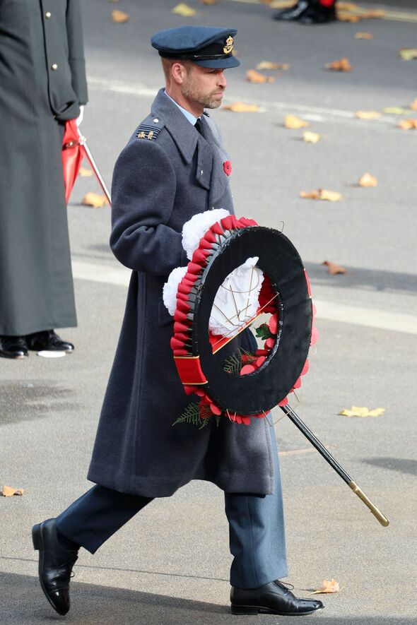Prince William carries his wreath