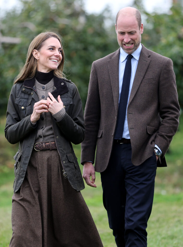 Prince William and Kate Middleton walking and smiling