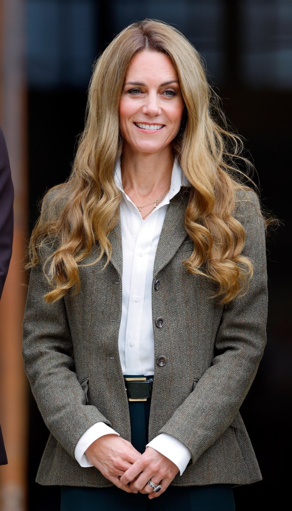 Catherine, Princess of Wales arrives for a visit to the Natural History Museum's newly renovated gardens in a brown jacket and dark blue jeans