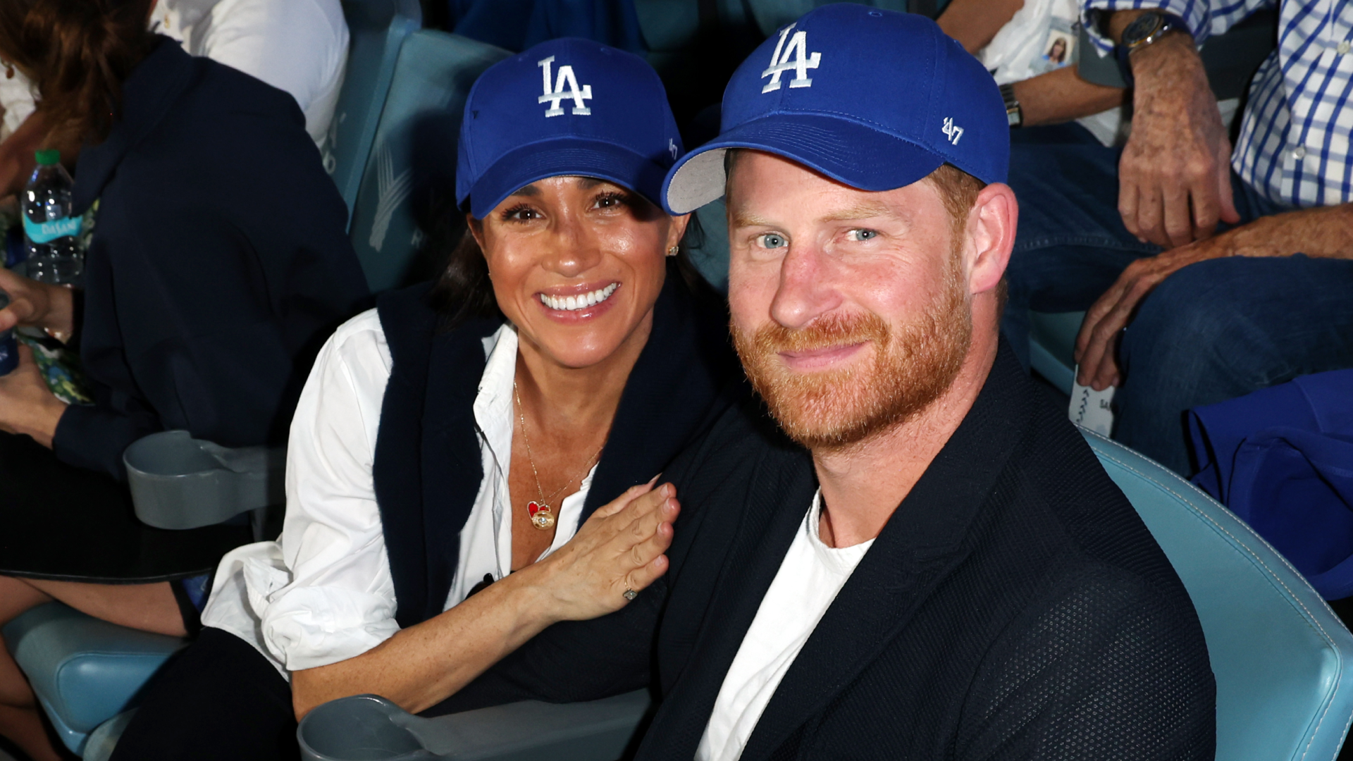 Meghan Markle Styles a Dodgers Cap With Cashmere and Diamonds For Surprise World Series Appearance With Prince Harry | Marie Claire