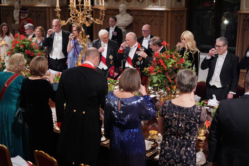 Guests raise a toast at a state banquet at Windsor Castle.