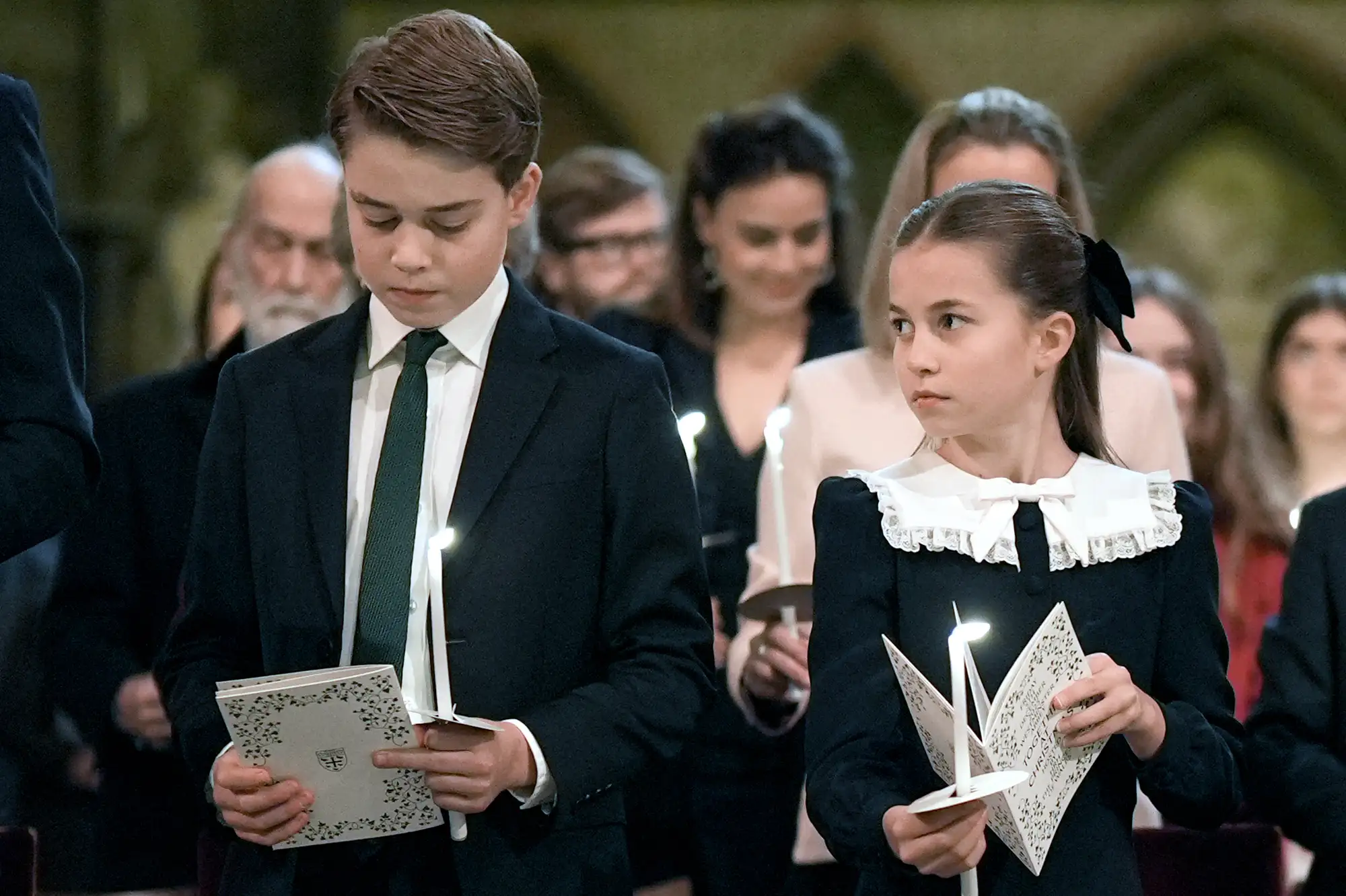 Britain's Prince George of Wales and Britain's Princess Charlotte of Wales attend the fifth annual "Together At Christmas" Carol Service" at Westminster Abbey in London on December 5, 2025.