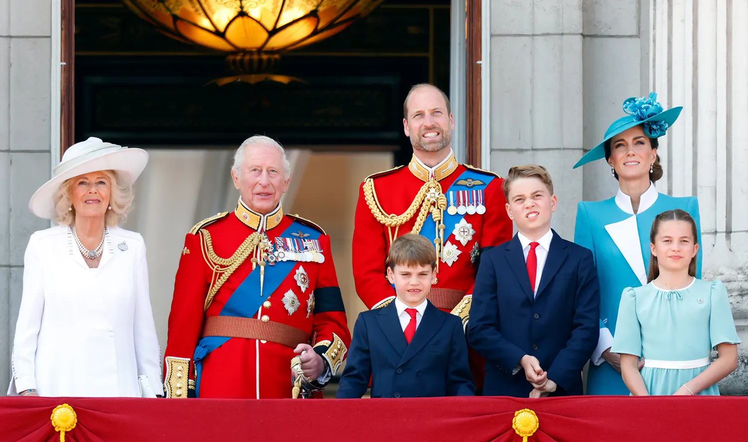 Queen Camilla, King Charles III (wearing his Coldstream Guards uniform), Prince Louis of Wales, Prince William, Prince of Wales (Colonel of the Welsh Guards), Prince George of Wales, Catherine, Princess of Wales and Princess Charlotte of Wales watch an RAF flypast from the balcony of Buckingham Palace after attending Trooping The Colour 2025 on June 14, 2025 in London, England.