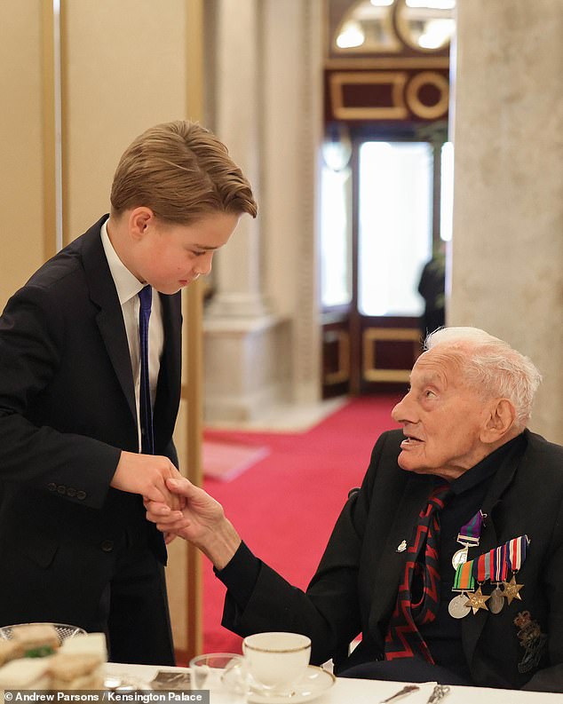 The prince, who was dressed in a smart suit and tie, was seen listening attentively to their stories while posing for photographs as George exuded a 'quiet confidence'