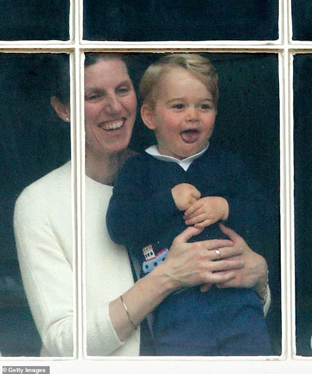 Prince George is held up at a window of Buckingham Palace by his nanny to watch Trooping the Colour in 2015