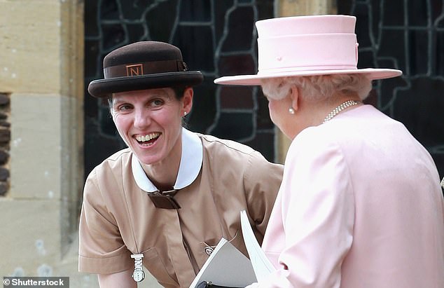 Ms Borrallo (in her Norland nanny uniform) talks to Queen Elizabeth II during the Christening of Princess Charlotte