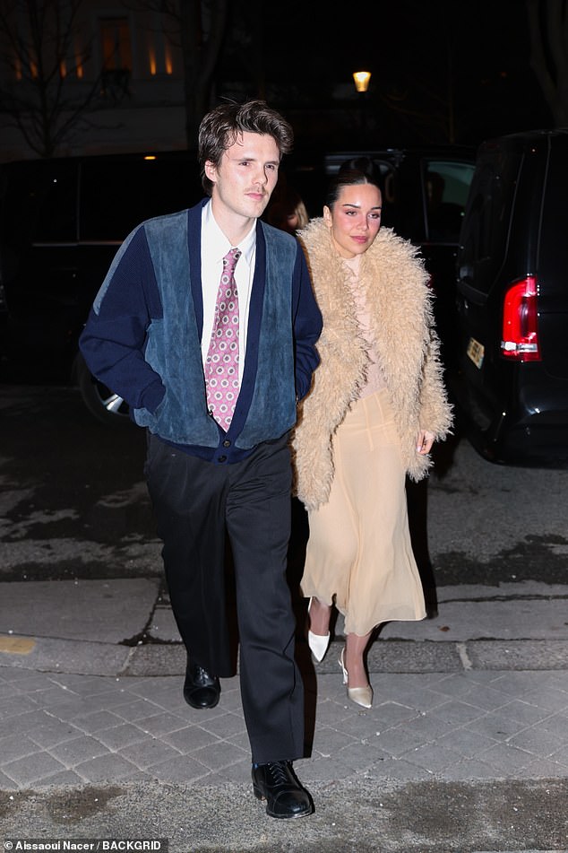 Youngest son Cruz was joined by his girlfriend Jackie, who looked fashion forward in a semi-sheer nude gown and a matching fluffy coat