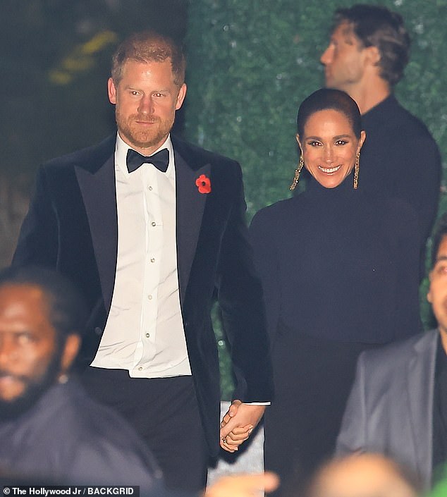 Prince Harry was notably seen wearing a poppy badge - an emblem of Remembrance Day - on his way into Jenner's party at Jeff Bezos and Lauren Sanchez's mansion (pictured)