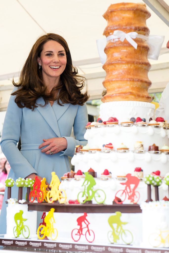 Kate looking at a cake