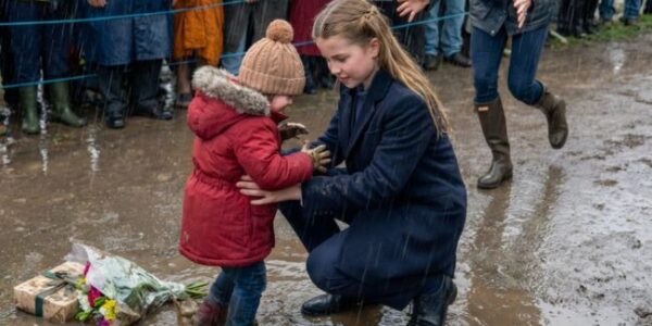 “Don’t worry, I’ve got you… it’s just a little rain.” The “Princess in the Rain”: A tiny, heart-melting detail in this photo of Princess Charlotte is going viral—can you spot it? There’s a reason the world is falling in love with this 10-year-old royal all over again. In a rare 5-minute moment captured by the Princess of Wales herself, Charlotte shows a side of her character that most people missed. Look at the way she connects with the toddler—there is one specific gesture that proves she’s a “Queen of Hearts” in the making. “Don’t worry, I’ve got you… it’s just a little rain.” The “Princess in the Rain”: A tiny, heart-melting detail in this photo of Princess Charlotte is going viral—can you spot it? There’s a reason the world is falling in love with this 10-year-old royal all over again. In a rare 5-minute moment captured by the Princess of Wales herself, Charlotte shows a side of her character that most people missed. Look at the way she connects with the toddler—there is one specific gesture that proves she’s a “Queen of Hearts” in the making.
