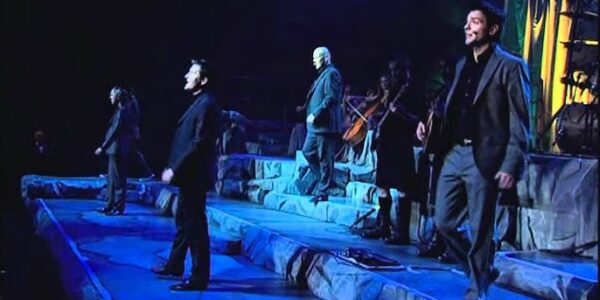 “STAY WITH ME ON THIS,” RYAN KELLY MURMURED — AND FROM BEHIND HIM, THE MEN OF CELTIC THUNDER ANSWERED, “WE’VE GOT YOU.” The exchange felt casual, almost like a quiet chat, but the moment Ryan Kelly stepped forward to sing “Brothers in Arms,” the room fell into a hush. Written during the Falklands War and made famous by Dire Straits in 1985, the song still carries the weight of loss, loyalty, and sacrifice. In this stripped-back, intimate performance, those emotions cut straight through. Kelly’s voice trembled with quiet resolve as the rest of Celtic Thunder wrapped him in harmony, like a final embrace — turning a war anthem into a deeply human farewell. It wasn’t flashy. It wasn’t loud. It was devastating — and impossible to look away