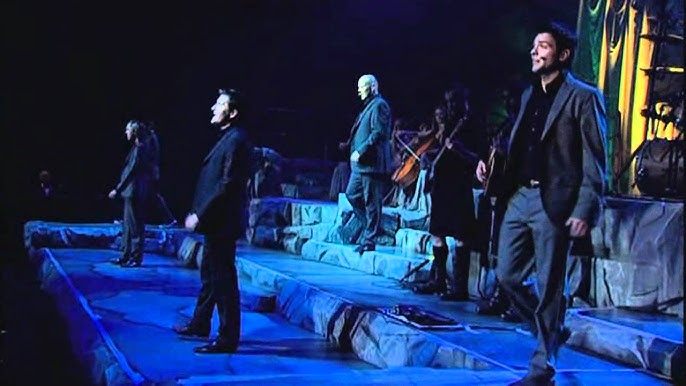 “STAY WITH ME ON THIS,” RYAN KELLY MURMURED — AND FROM BEHIND HIM, THE MEN OF CELTIC THUNDER ANSWERED, “WE’VE GOT YOU.” The exchange felt casual, almost like a quiet chat, but the moment Ryan Kelly stepped forward to sing “Brothers in Arms,” the room fell into a hush. Written during the Falklands War and made famous by Dire Straits in 1985, the song still carries the weight of loss, loyalty, and sacrifice. In this stripped-back, intimate performance, those emotions cut straight through. Kelly’s voice trembled with quiet resolve as the rest of Celtic Thunder wrapped him in harmony, like a final embrace — turning a war anthem into a deeply human farewell. It wasn’t flashy. It wasn’t loud. It was devastating — and impossible to look away