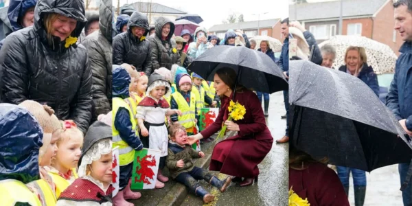 Princess Catherine comforts a child in the rain.