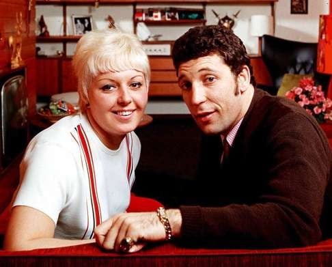 He’s the man behind timeless hits like “It’s Not Unusual” and “Delilah,” but now, at 84, Sir Tom Jones is writing a new love song — one that’s playing out far from the stage lights and right inside his private estate in the British countryside. The headlines say he’s engaged. The whispers say she might be the biggest surprise of all.