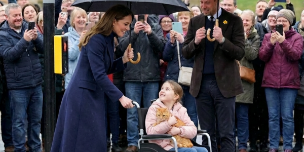 Watch the heart-stopping moment Catherine abandons her umbrella to transform into a human shield in the pouring rain!