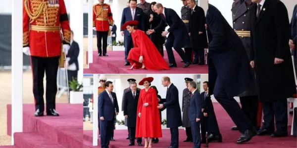 As Catherine was walking onto the stage in her striking bright red outfit As Catherine was walking onto the stage in her striking bright red outfit